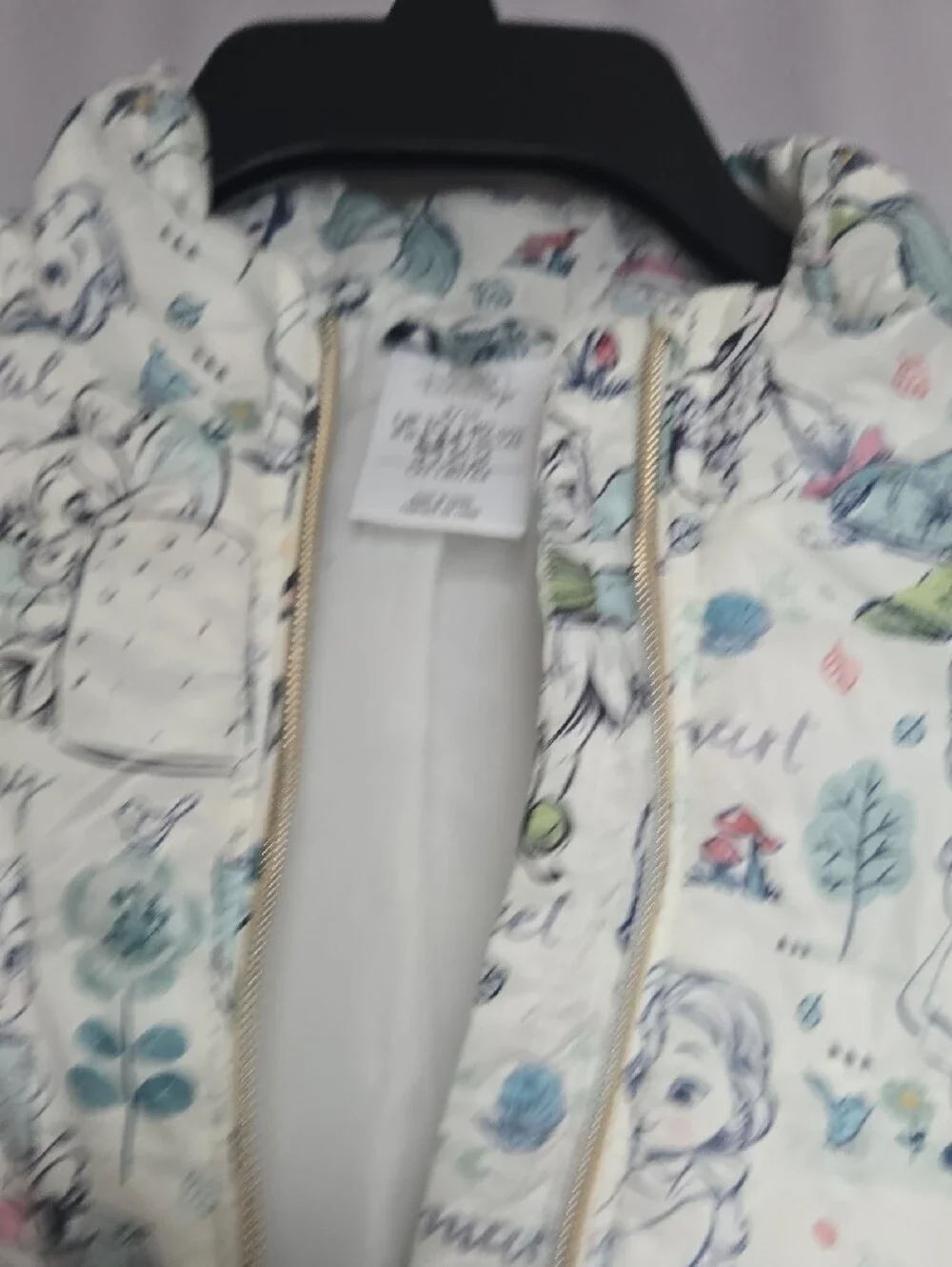 Disney Quilted Puffer Jacket with Cream Background and Pastel Accents